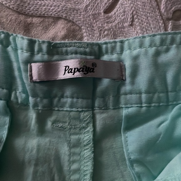 Size large, light teal shorts with navy blue belt. From papaya. Never worn - Picture 2 of 3